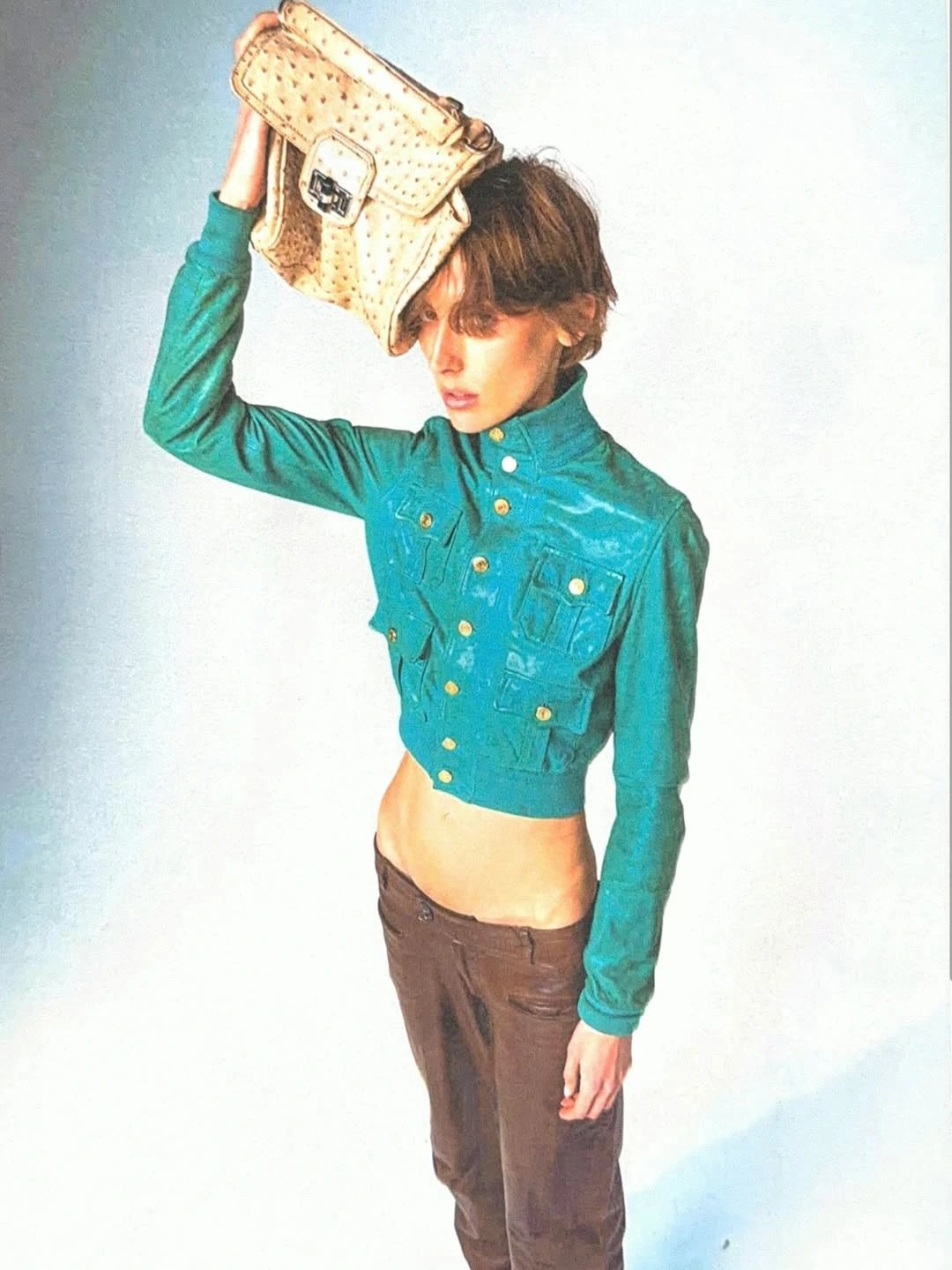 Stine — turquoise jacket and straw bag