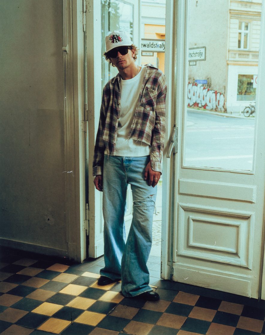New Era campaign portrait in a doorway