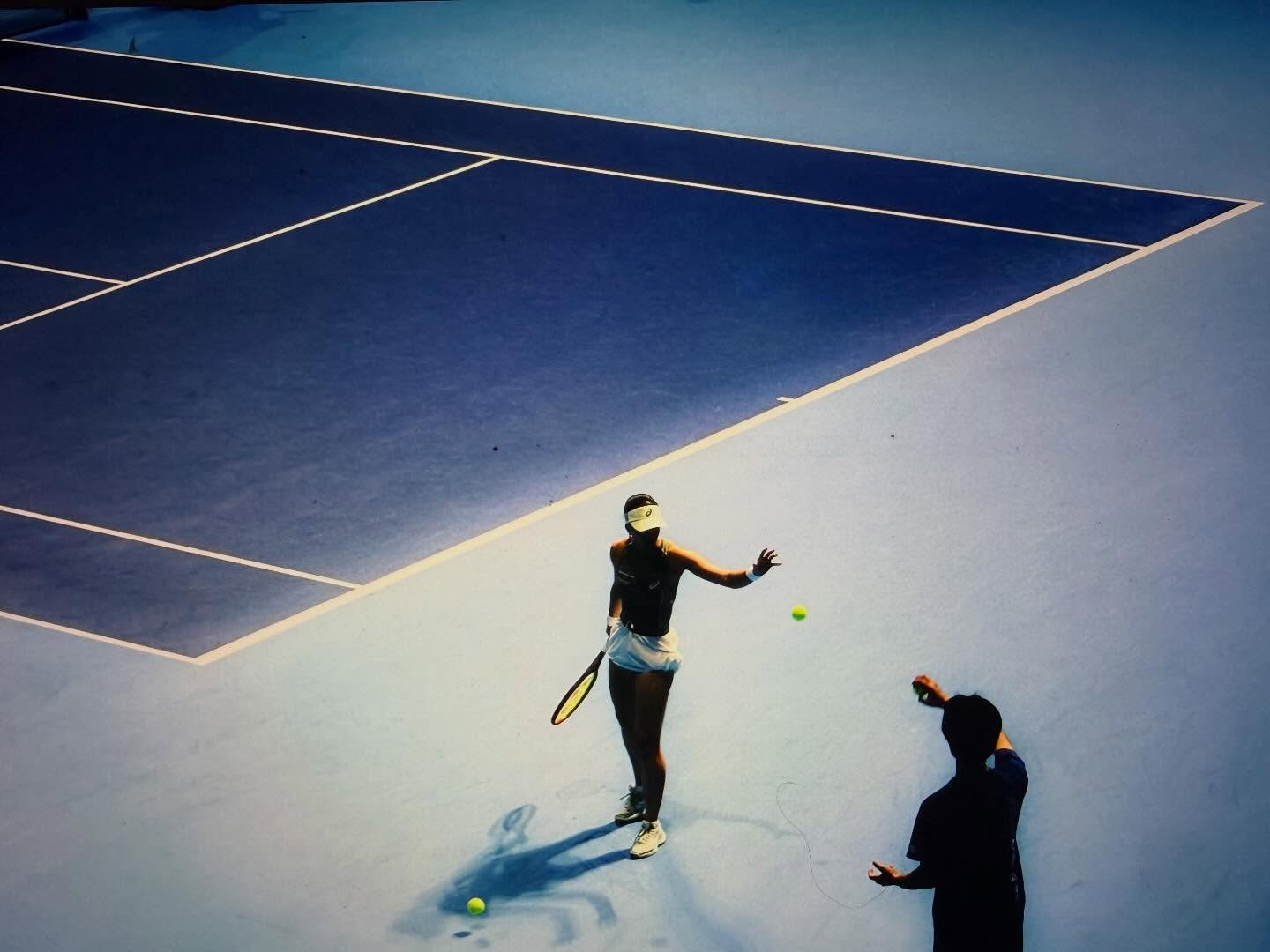 Blue tennis court from above