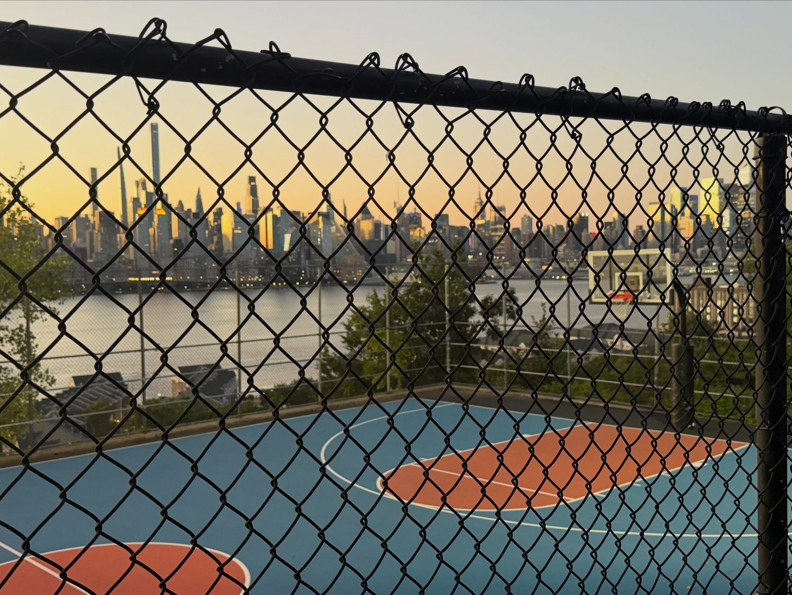 Basketball court overlooking New York skyline