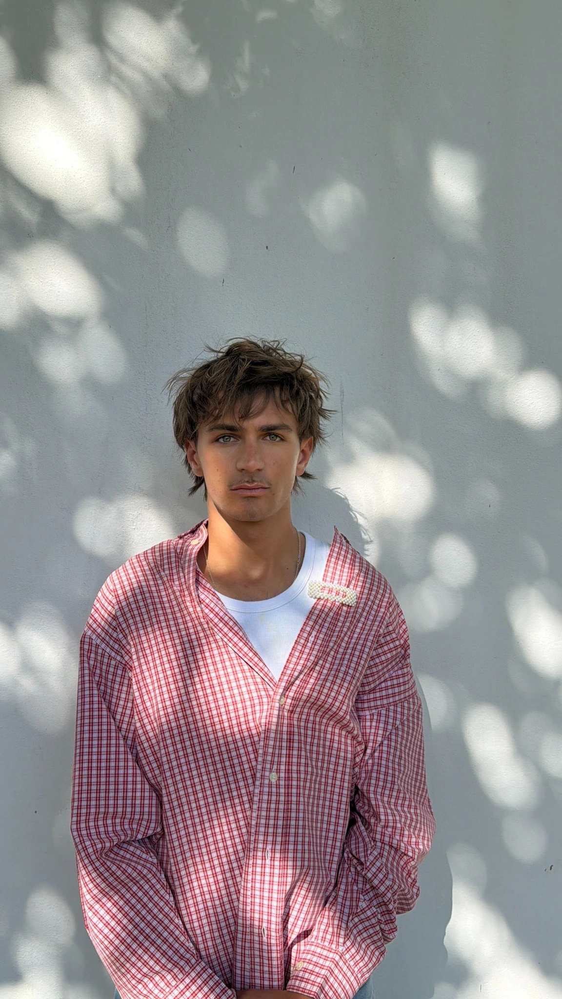 Jupp Simon in a red checked shirt photographed in natural light